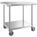 A Regency stainless steel work table with undershelf and casters.