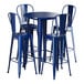 A Lancaster Table & Seating blue metal bar height table with four chairs.