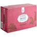 A pink box with a white label that reads "Lyre's Dark and Spicy Non-Alcoholic Mocktail" with a bird on it.