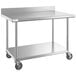 A Regency stainless steel work table with undershelf and casters.