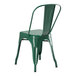 A green metal chair with a green seat and back.