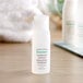 A close-up of a white Serene Elements shampoo bottle with a green label.