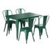 A Lancaster Table & Seating emerald green metal table with four chairs.