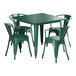 A green Lancaster Table & Seating rectangular table with four chairs.