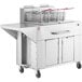 A Backyard Pro double tank outdoor fryer with wheels.