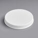 A 110/400 white plastic lid with a cap on.