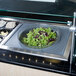 A Cambro salad bowl holder with a bowl of salad on a counter.