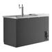 An Avantco black kegerator with a silver double tap tower on a counter.
