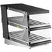 A black and silver ServIt countertop heated display case with slanted shelves.