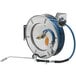 A T&S stainless steel hose reel with a hose attached.