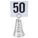 An American Metalcraft spiral metal table card holder with the number 50 on it.