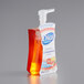 A package of 8 Dial Citrus Sunburst foaming hand soap bottles with orange and red labels and pumps.