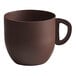 A brown Mona Lisa coffee cup with a handle.