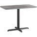 A Lancaster Table & Seating rectangular table with a black base and slate gray top.