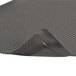 A close-up of a black Notrax Bubble Trax Ultra anti-fatigue mat.