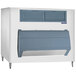 A white Scotsman ice storage bin with a blue door.