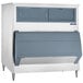 A Scotsman stainless steel ice storage bin with two drawers.