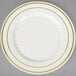 A Fineline Silver Splendor ivory plastic plate with gold bands on the rim.