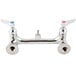 A T&S chrome wall mount mop sink faucet with lever handles.