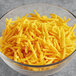 A bowl of Daiya Vegan Shredded Cheddar Cheese.