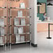 A Metro heated stainless steel takeout station shelf.