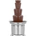 A Sephra chocolate fountain with a metal stand.