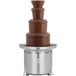 A Sephra Montezuma chocolate fountain on a stand on a table.