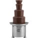 A Sephra chocolate fountain on a metal stand.