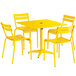 A yellow table and chairs on an outdoor patio.