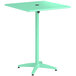 A seafoam green Lancaster Table & Seating bar height table with a black metal top.