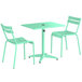 A Lancaster Table & Seating outdoor table in seafoam with two chairs.