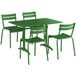 A Lancaster Table & Seating green aluminum table with chairs on an outdoor patio.