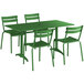 A green table with chairs on an outdoor patio.