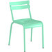 A seafoam green plastic chair with metal legs.