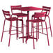 A Lancaster Table & Seating Sangria bar height table with four barstools on an outdoor patio.