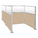 A Versare Hush Panel beige double cubicle with glass panels.