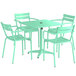 A Lancaster Table & Seating outdoor table with a green top and 4 chairs around it.