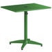 A green Lancaster Table & Seating outdoor table with a metal base.