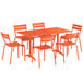 An orange Lancaster Table & Seating outdoor table and chairs set.