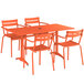 An orange Lancaster Table & Seating outdoor table and chairs set with an umbrella hole.