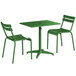 A green table with two green chairs.