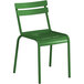 A green metal chair with a backrest.