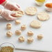 A person's hands forming Tindle plant-based chicken dough.