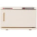 A white machine with red buttons.
