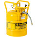 A yellow metal cylinder with a yellow metal hose attached.