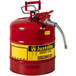 A red Justrite safety can with a metal hose.