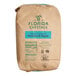 A brown bag of Florida Crystals Organic 10X Powdered Raw Cane Sugar.