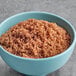 A bowl of Florida Crystals Organic Dark Brown Cane Sugar.