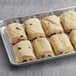 A tray of White Toque ready to bake chocolate croissants on a gray surface.