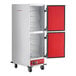 An Avantco full size heated holding cabinet with solid red and white doors.